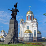 Monument to Komsomol of Ural and churches in Yekaterinburg